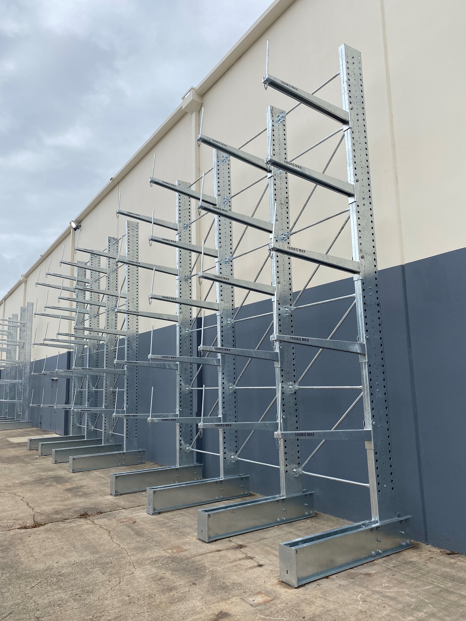 Long and heavy steel storage racks placed outside the warehouse