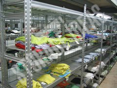 Clothes placed on the shelves of the warehouse