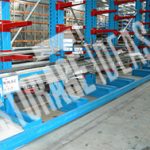 Blue & red color racks connected with each other and place on the warehouse
