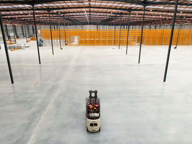 Spacious warehouse area with steel platted racks design